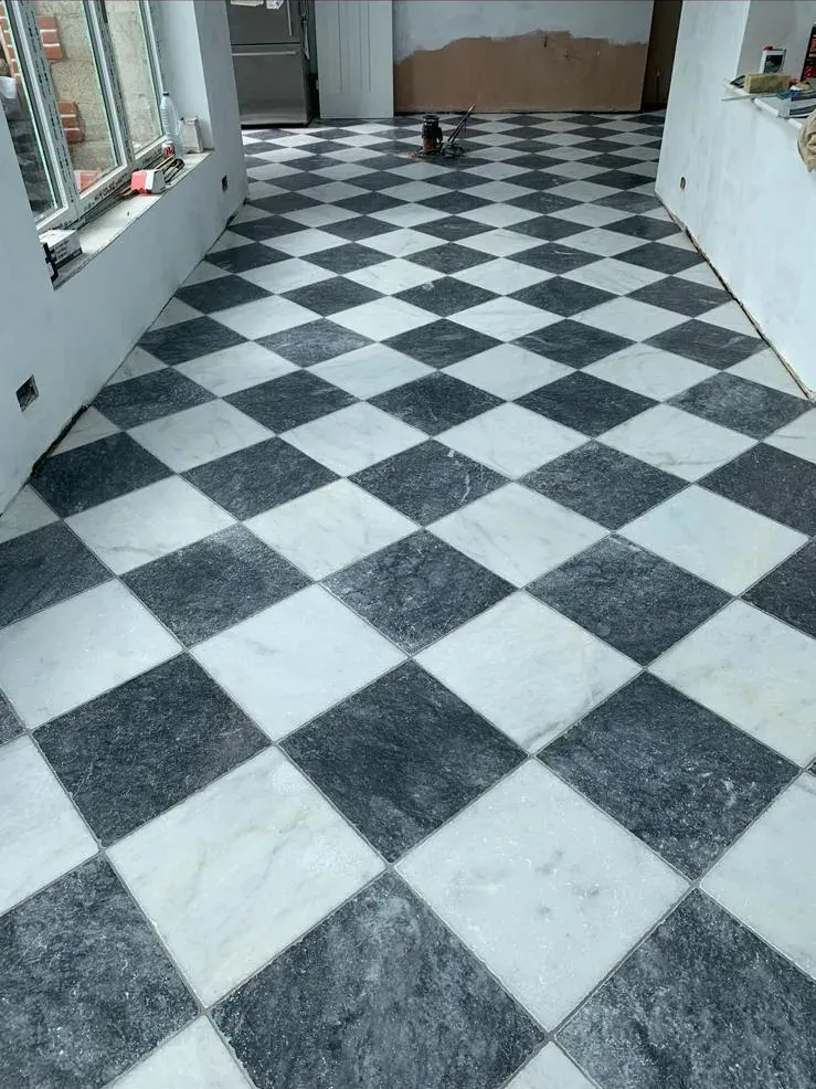 Checkerboard marble floor by Prestige Tiling