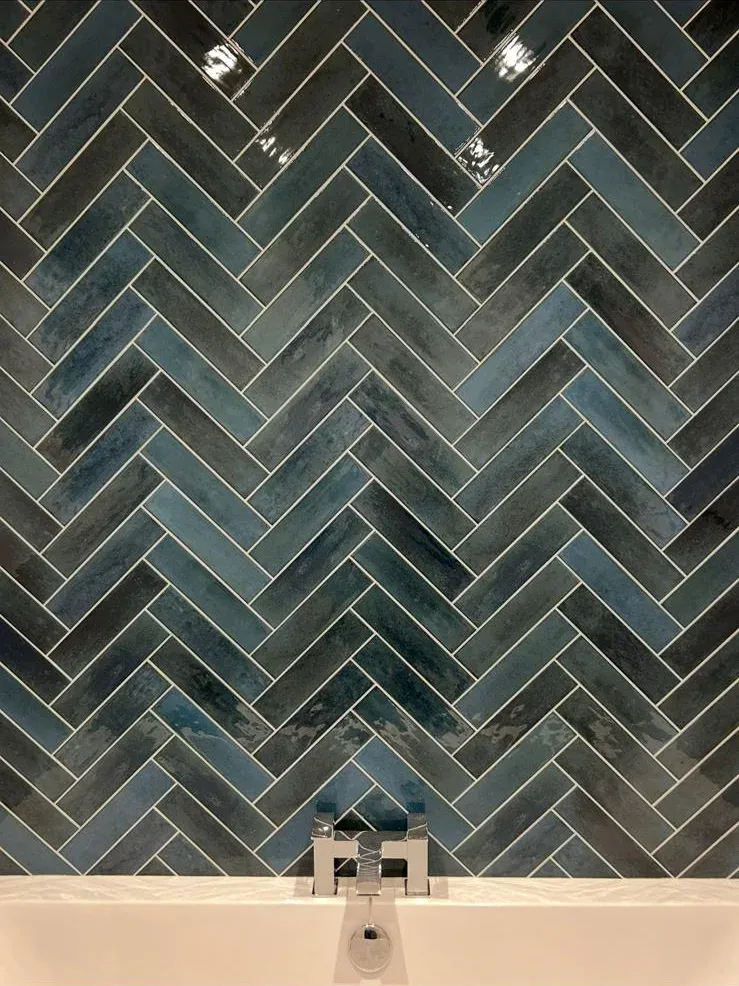 Teal herringbone bath wall by Prestige Tiling