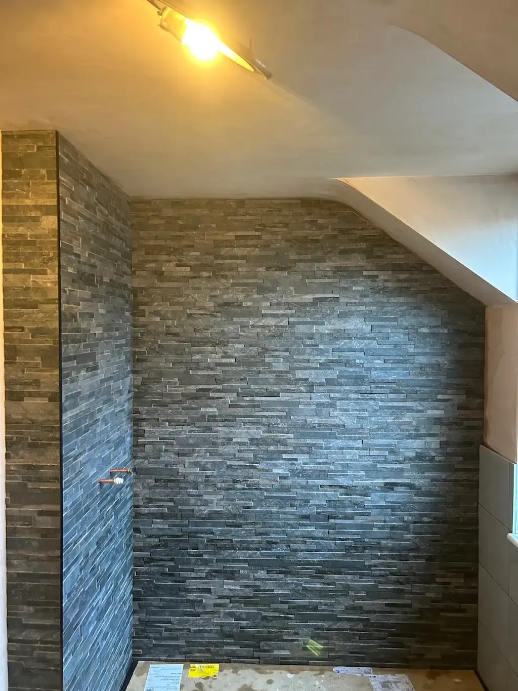 Split-face stone wall by Prestige Tiling